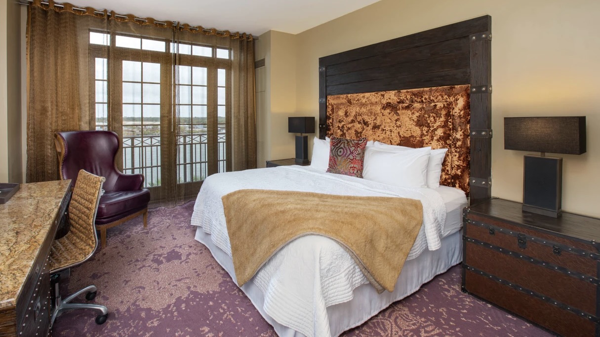 The Bohemnian room with bedding at one of the best luxury Savannah riverfront hotels